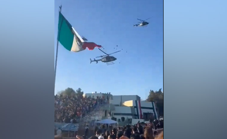 Captan a helicóptero cortar la Bandera monumental en el Campo Militar